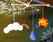 Häkel-Mobile mit Sonne, Wolken, Regen und Regenbogen