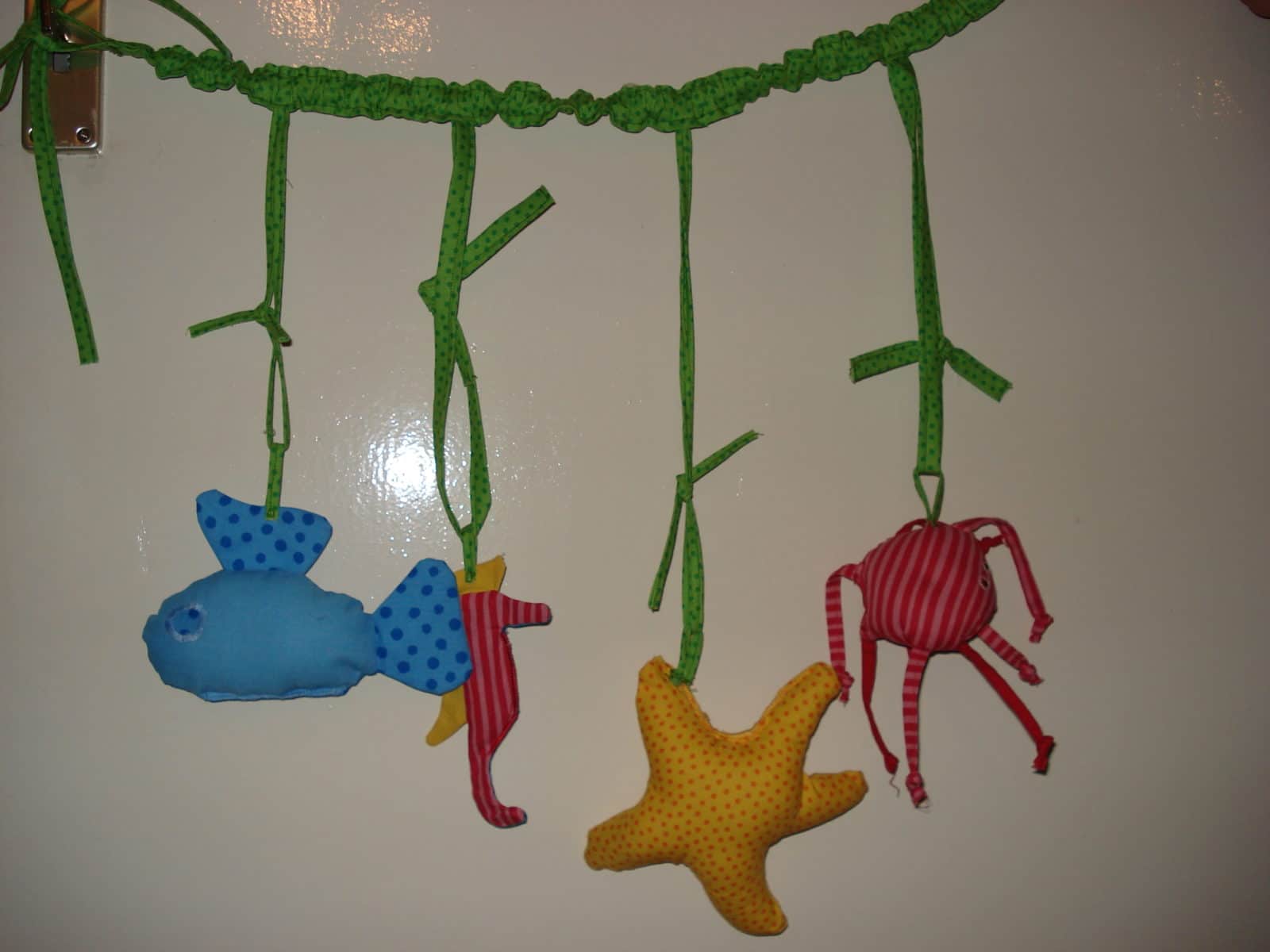 Spielkette für’s Babybettchen