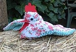 Henne aus Gartenhandschuh