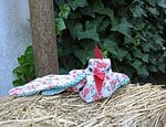 Henne aus Gartenhandschuh
