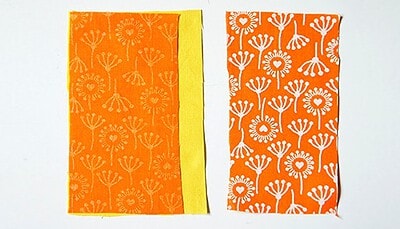 Zwei Stoffstücke mit Blumenmuster in Orange, geeignet für Näharbeiten wie Plissee und Innentaschen, passend zum Sew Along Tag 3.