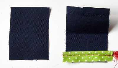 Zwei Stoffstücke, eines mit Paspel in grün mit weißen Punkten, geeignet für Nähprojekte im Rahmen des Sew Along Tag 2 - Paspel, Henkel und Schleife.