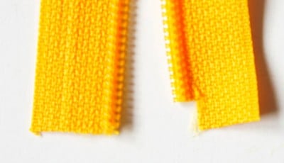 Gelbe Reißverschlüsse für Nähprojekte, ideal für Clutches und Accessoires, handgemacht und vielseitig einsetzbar.
