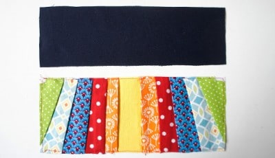 Stoffe in verschiedenen Farben und Mustern, vorbereitet für die Herstellung einer Clutch, mit schwarzem Stoff als Basis, im Rahmen eines Sew Along Projekts.