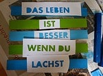 Schild oder Topfuntersetzer aus Holz mit Spruch