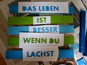 Schild oder Topfuntersetzer aus Holz mit Spruch