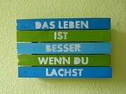 Schild oder Topfuntersetzer aus Holz mit Spruch