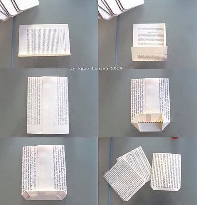 Kreativer Adventskalender aus recycelten Buchseiten, gefaltet zu kleinen Boxen, ideal für nachhaltiges Weihnachtsdekor und handgemachte Dekorationen.