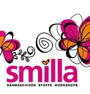 Bunte Schmetterlinge und kreative Nähprojekte, die die HANDMADE Kultur mit Nähmaschinen, Stoffen und Workshops präsentieren, ideal für Handarbeitsliebhaber.