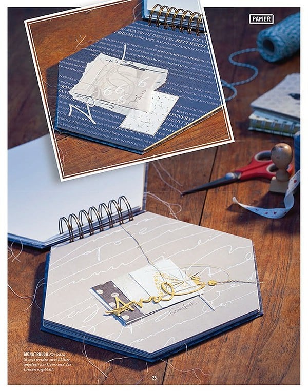 Schablone für Ringbuch mit goldener Beschriftung, Nadel, Faden und Schneiderschere für kreative Handarbeit, passend für DIY-Projekte und Bastelarbeiten.