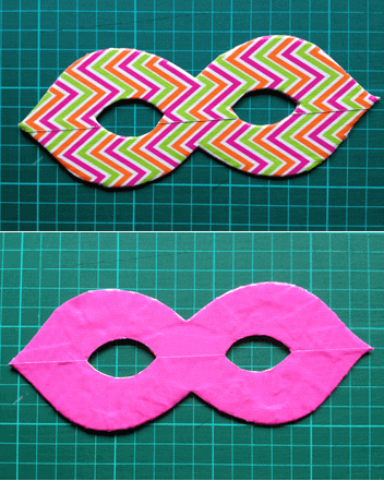 Zwei selbstgemachte Masken, eine bunte mit Zickzackmuster aus Stoff und eine pinke aus Filz, ideal für kreative Bastelprojekte bei Handmade Kultur.