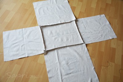 Leinwandstoff für DIY-Projekt, zum Basteln eines Hockers aus Getränkekisten, nachhaltiges Upcycling, kreative Möbelgestaltung, handgemacht, umweltfreundlich, nachhaltiges Design.