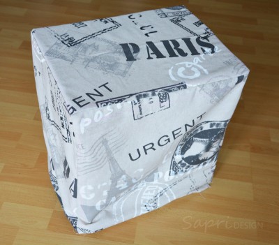 Hochwertiger DIY Hocker aus alten Getränkekisten mit Postkarten-Design, ideal für nachhaltiges Upcycling und kreative Wohnideen.