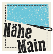 Logo von HANDMADE Kultur mit dem Schriftzug Nähe Main, symbolisiert lokale Handwerkskunst und kreative Gemeinschaften in der Region.