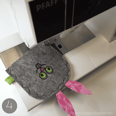 Handgemachter Filz-Hanhandwärmer in Hasenform mit rosa Ohren, geeignet für den Winter, hergestellt aus Filz, für warme Hände, kreative Handarbeit, ideal als Geschenk.