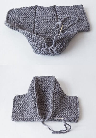 Handgestrickte graue Hausschuhe aus Wolle, in Arbeit, mit Nadel und Faden, für gemütliche Tage zu Hause.