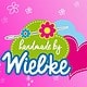 Logo von HANDMADE Kultur mit bunten Blumen, Herz und Sticknadel auf pinkem Hintergrund, ideal für handgemachte Produkte und kreative DIY-Projekte.