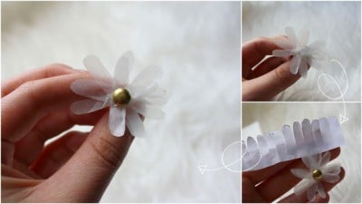 Handgefertigtes Papierblümchen mit goldener Mitte, ideal für kreative Bastelprojekte und Dekorationen im Rahmen von Papierblumen-Kunst.