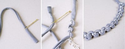 Detailaufnahme einer gehäkelten Statement-Kette mit silbernen Ringen und grauem Stoff, zeigt den Herstellungsprozess und die Textur des Materials.