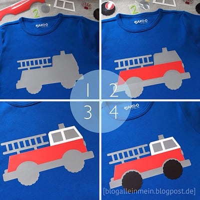 Buntes Feuerwehr-Plottdesign auf blauem T-Shirt mit mehrfarbigen Elementen und Feuerwehrauto-Motiv für Kinder.