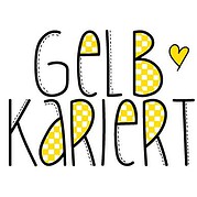 Handgemachte kreative Buchstaben mit gelben Mustern und Herz, symbolisieren handgefertigte Kunst und Kreativität bei HANDMADE Kultur.
