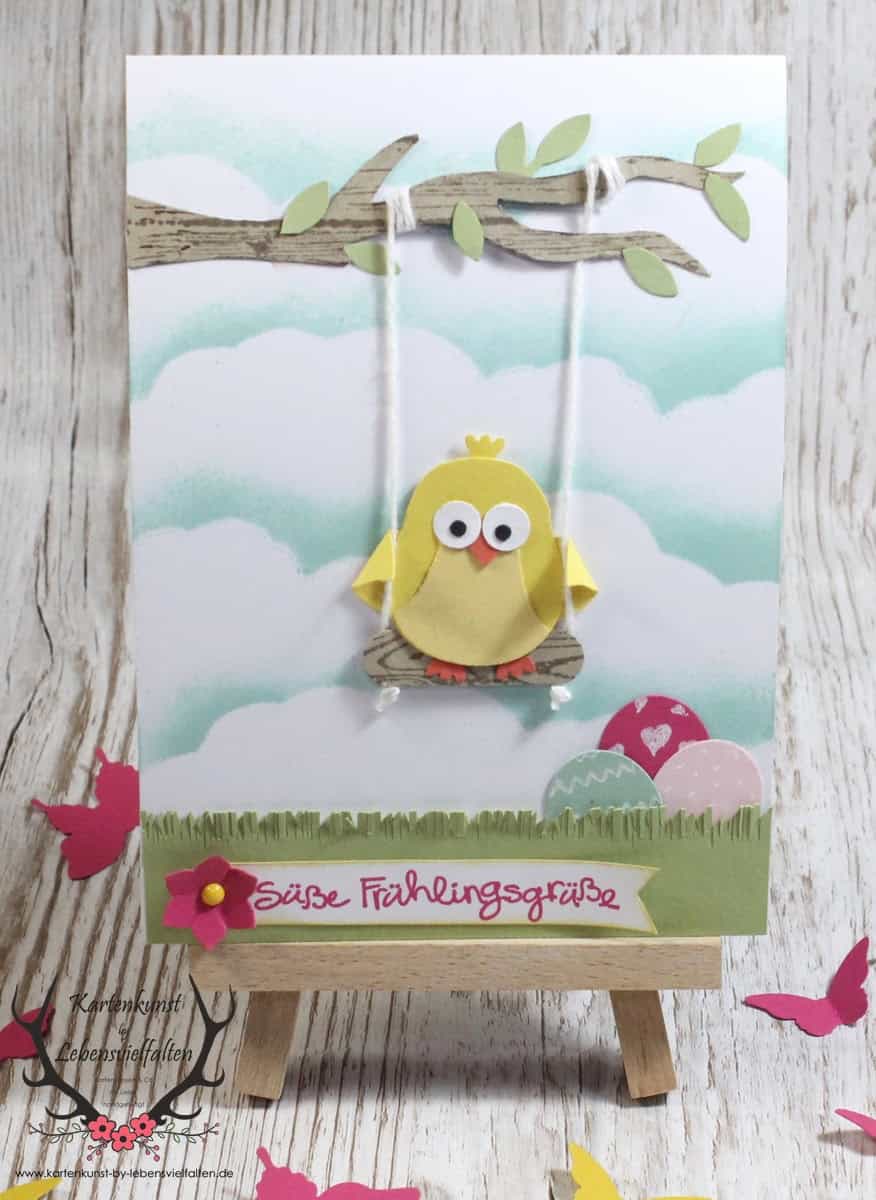 Osterkarte mit Küken auf der Schaukel und Frühlingsgruß