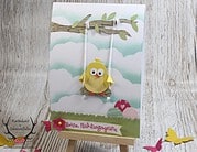 Osterkarte mit Küken auf der Schaukel und Frühlingsgruß