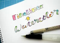 Handlettering mit Fineliner und Wasserfarbe malen