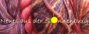Bunte handgefertigte Wolle in verschiedenen Farben und Texturen, präsentiert bei HANDMADE Kultur, ideal für kreative Handarbeiten und Strickprojekte.