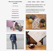 Bunte Wollknäuel, gesticktes Herz auf Stoff, Strick- und Häkelarbeiten, kreative Handarbeit für DIY-Liebhaber bei HANDMADE Kultur.