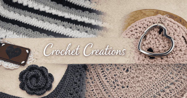 Handgemachte Schmuckstücke und Accessoires, darunter gestrickte Gegenstände, eine Herz-Schließe und eine kleine Blume, präsentiert im Rahmen der Handmade Kultur.